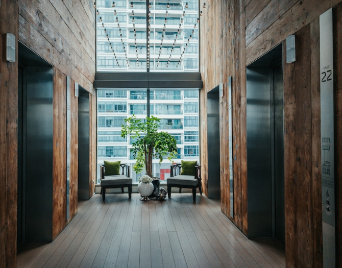 corridor with elevators on the side